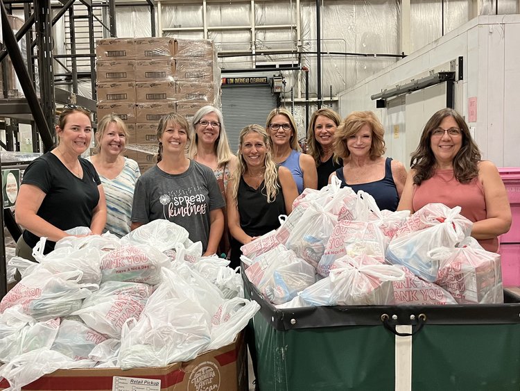 Volunteers packing donation bags for Hocking Hills Gives Back community outreach