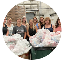 Volunteers preparing donation bags for Hocking Hills Gives Back community initiative