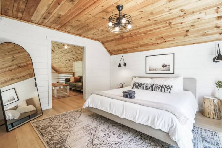 Stylish wood-accented bedroom with king bed